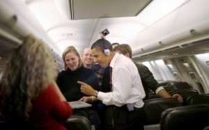 Barack Obama rocking to music on his Mac on airplane