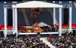 Dalai_Lama_2009-05-03_Boston_Gillette Stadium Dalai Lama, at an address at Gillette stadium in the Boston area. Addressing the crowd of 16,000 on the path to peace and happiness. Wore Patriots cap. May 2009
