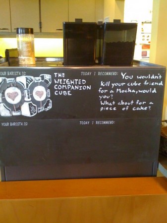 Portal Weighted Companion Cube talks about cake, geeky cafe art at coffee shop